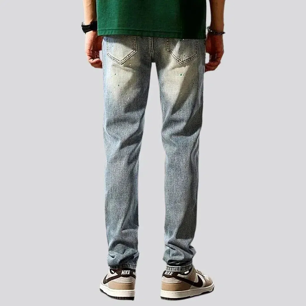 Grunge men's distressed jeans