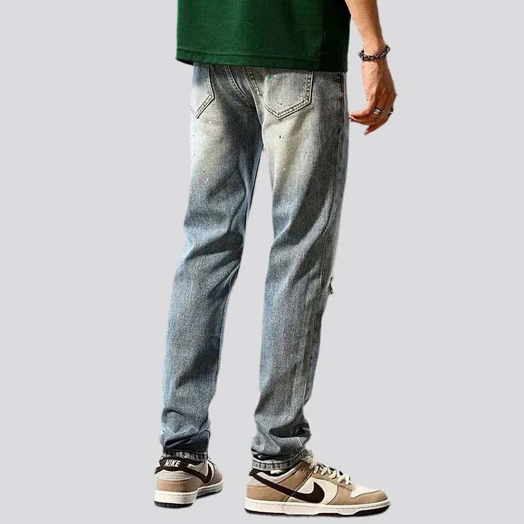 Grunge men's distressed jeans